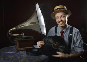 Lon Eldridge with a 1905 Victor V-2 phonograph at his Chattanooga home. Mr Eldridge collects vinyl records and restores phonographs. Thursday Aug 20, 2016 (Photo by Billy Weeks)