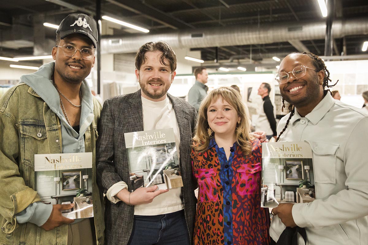 Group of four people holding Nashville Interiors magazine books Photo by Nashville Interiors