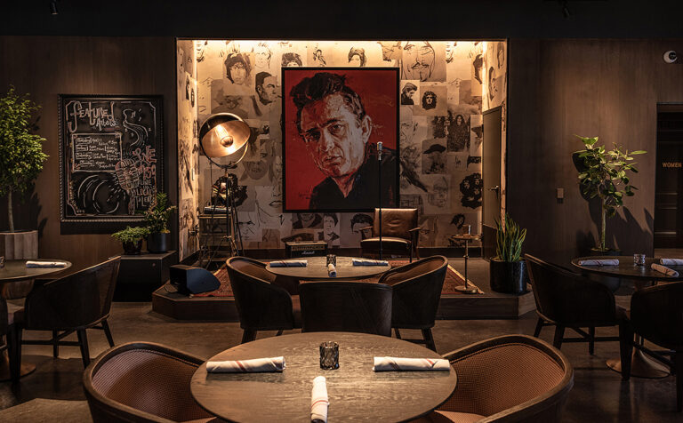 Stylish restaurant interior with a vintage portrait on the wall - Nashville Interiors