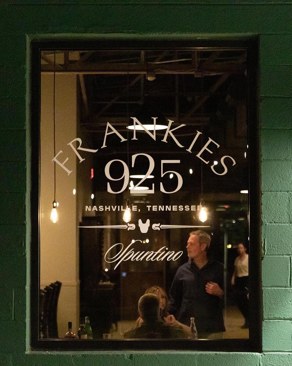 Frankie's 925 Spuntino restaurant window in Nashville at night - Nashville Interiors