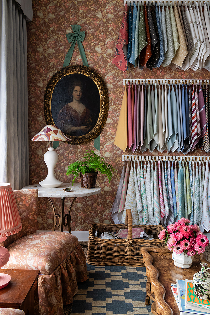 Elegant room with fabric samples, portrait, and classic decor - Nashville Interiors